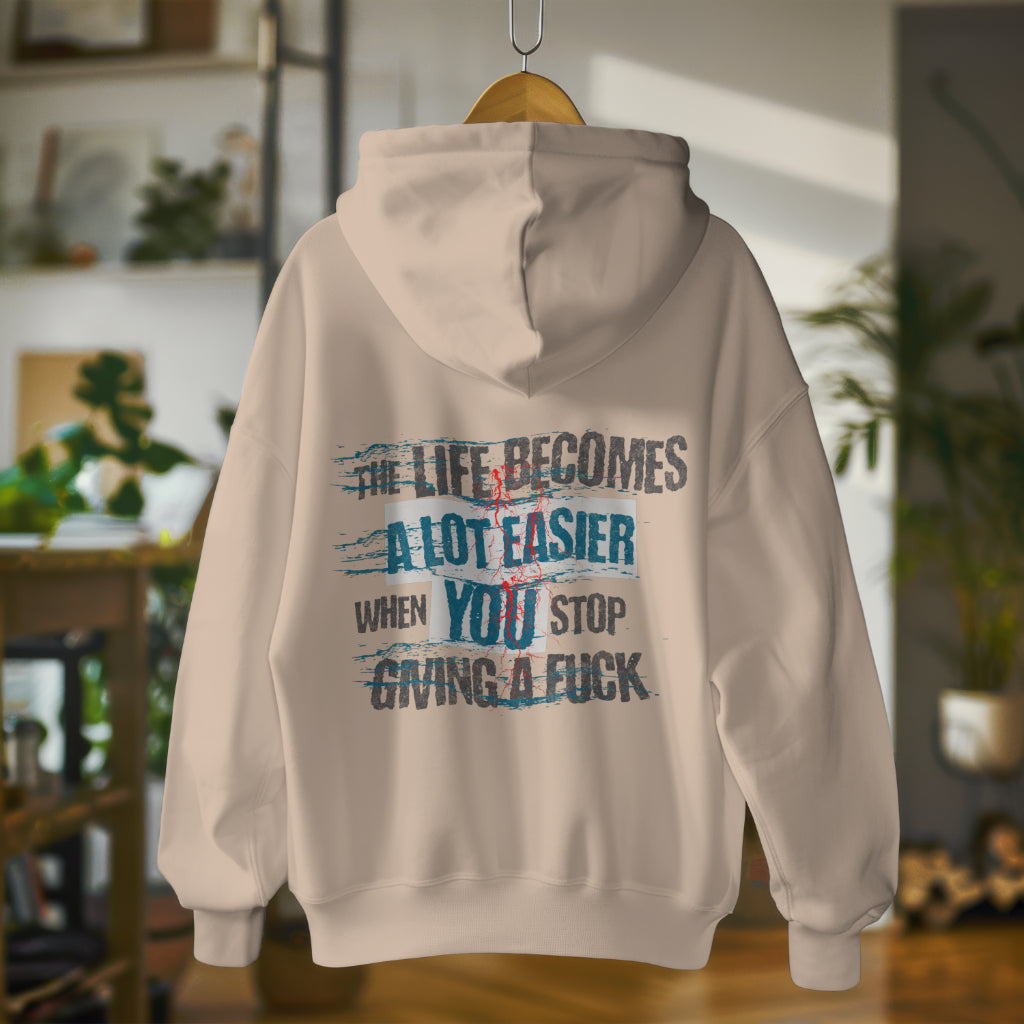 Oversized streetwear hoodie with bold phrase - The Life Becomes a Lot Easier When You Stop Giving a F**k - by Worn & Wicked Co.