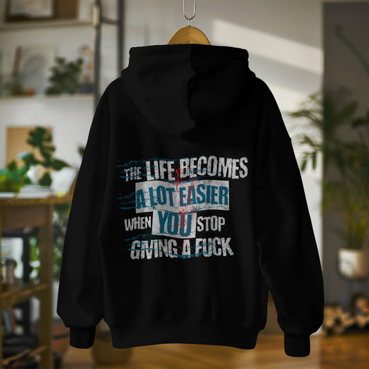 Oversized streetwear hoodie with bold phrase - The Life Becomes a Lot Easier When You Stop Giving a F**k - by Worn & Wicked Co.